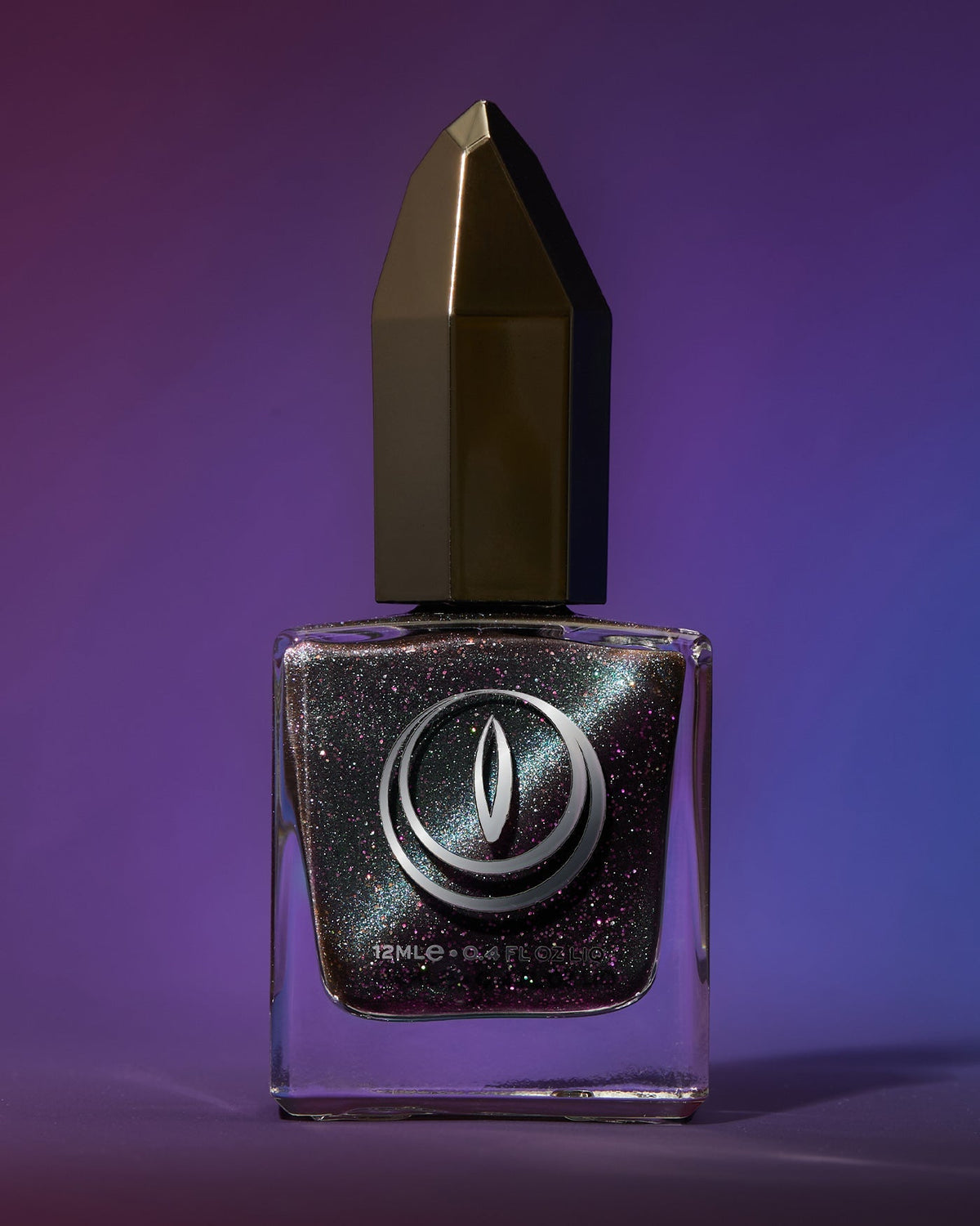 Sleek square glass bottle of dark metallic magnetic glitter nail polish with faceted gold black cap