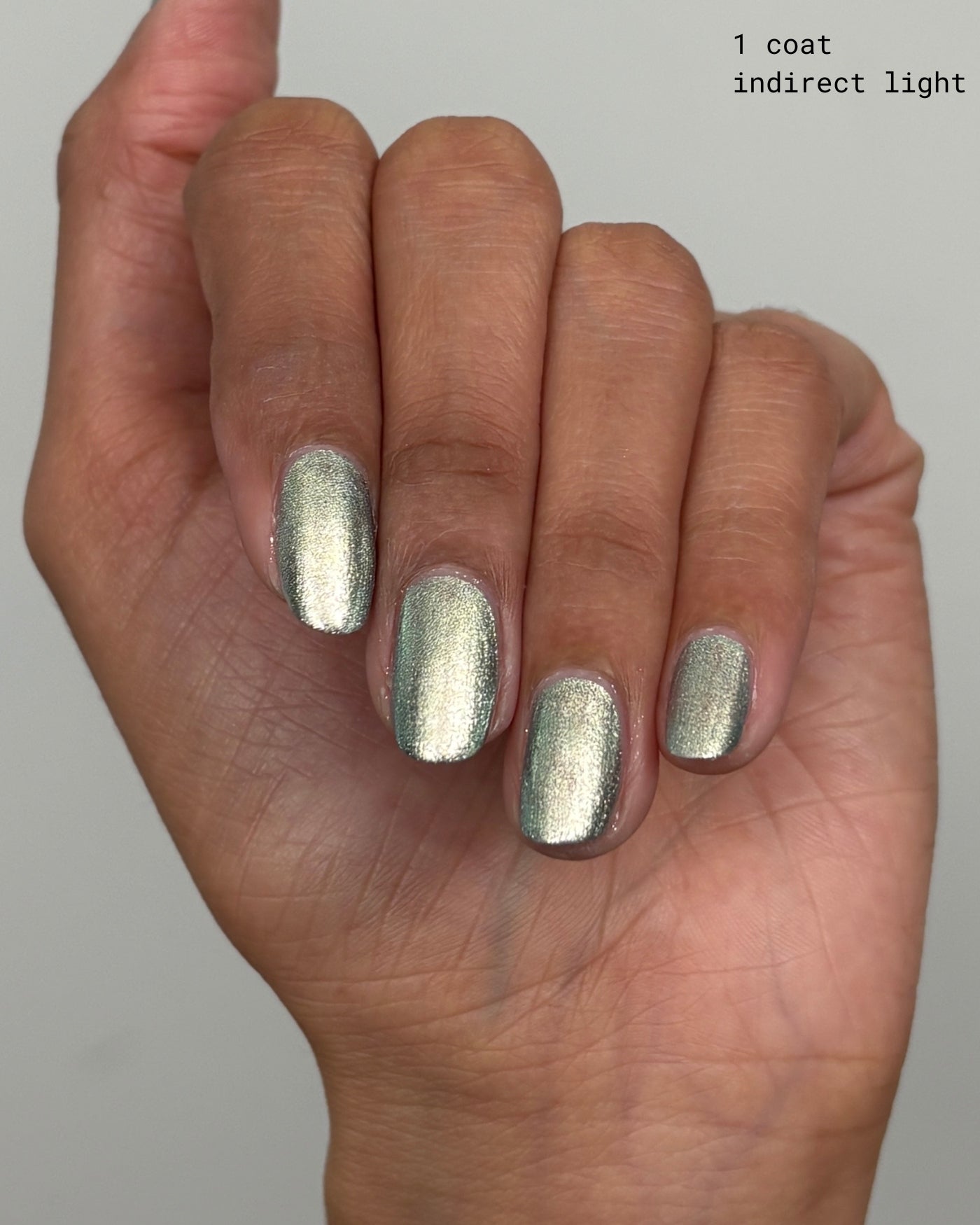 Shimmering Atomica silver metallic nail polish in single coat