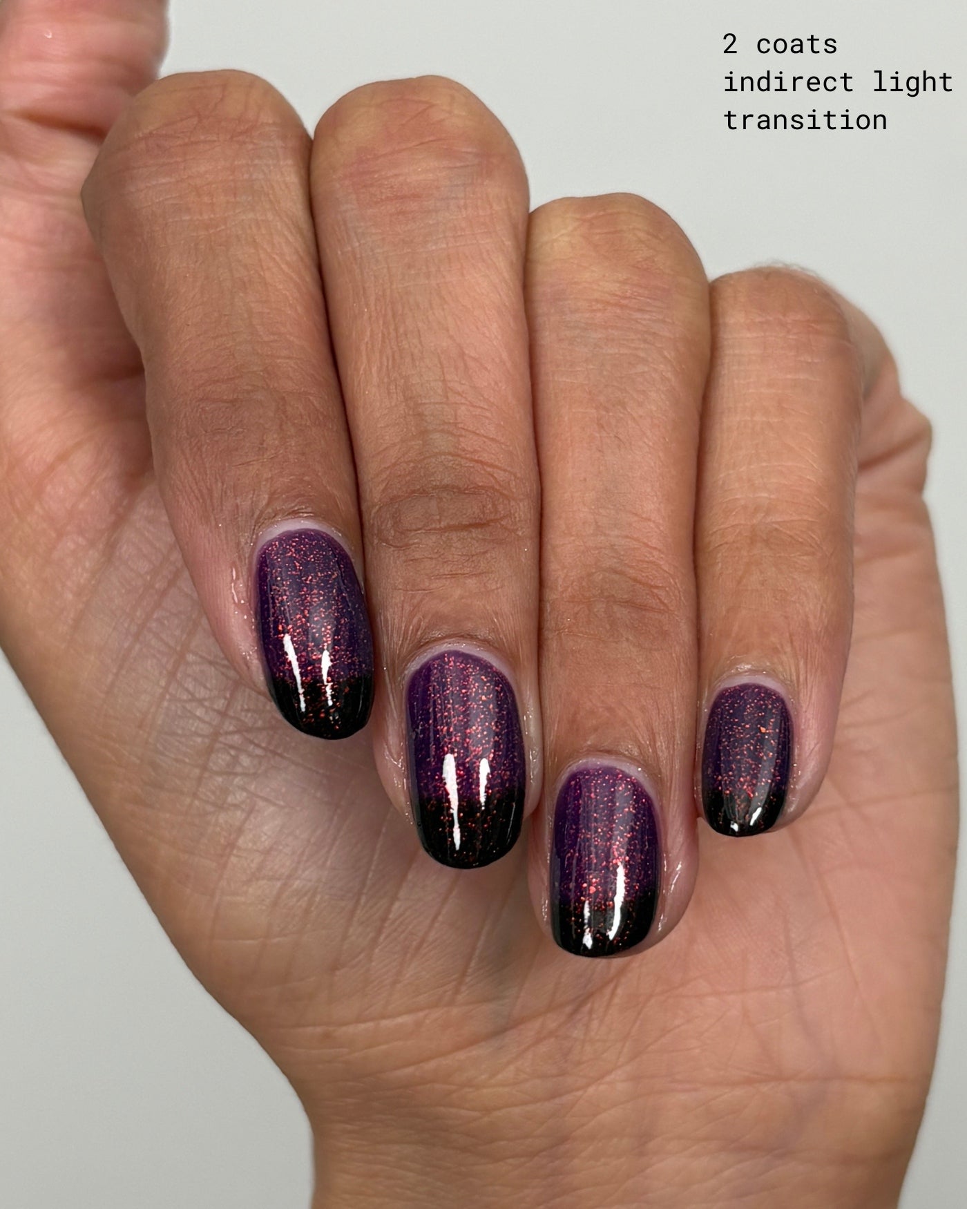 The Firebird shimmering purple-to-black gradient glitter nails glossy finish