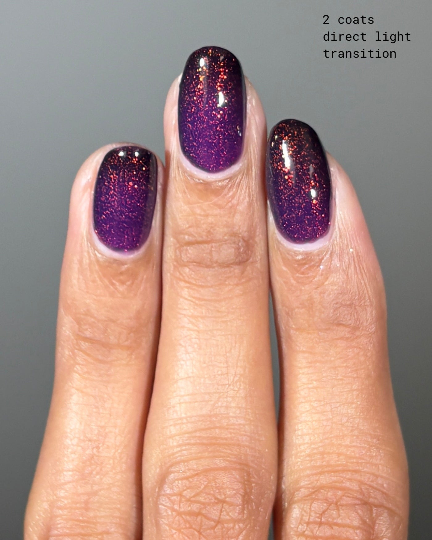 Purple glitter nail polish The Firebird with shimmering iridescent finish
