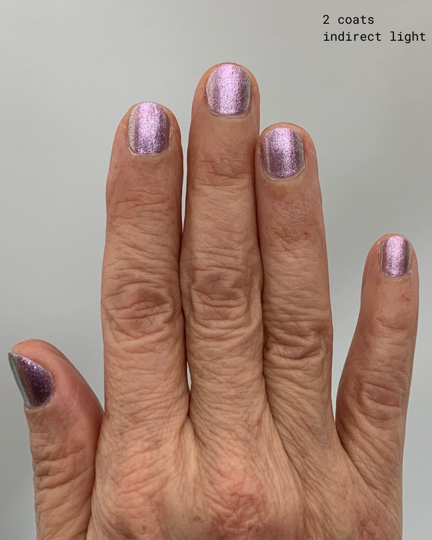 Shimmering lavender metallic Nightbreak nail polish in two coats