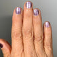 Shimmering lavender glitter Nightbreak nail polish in two coats
