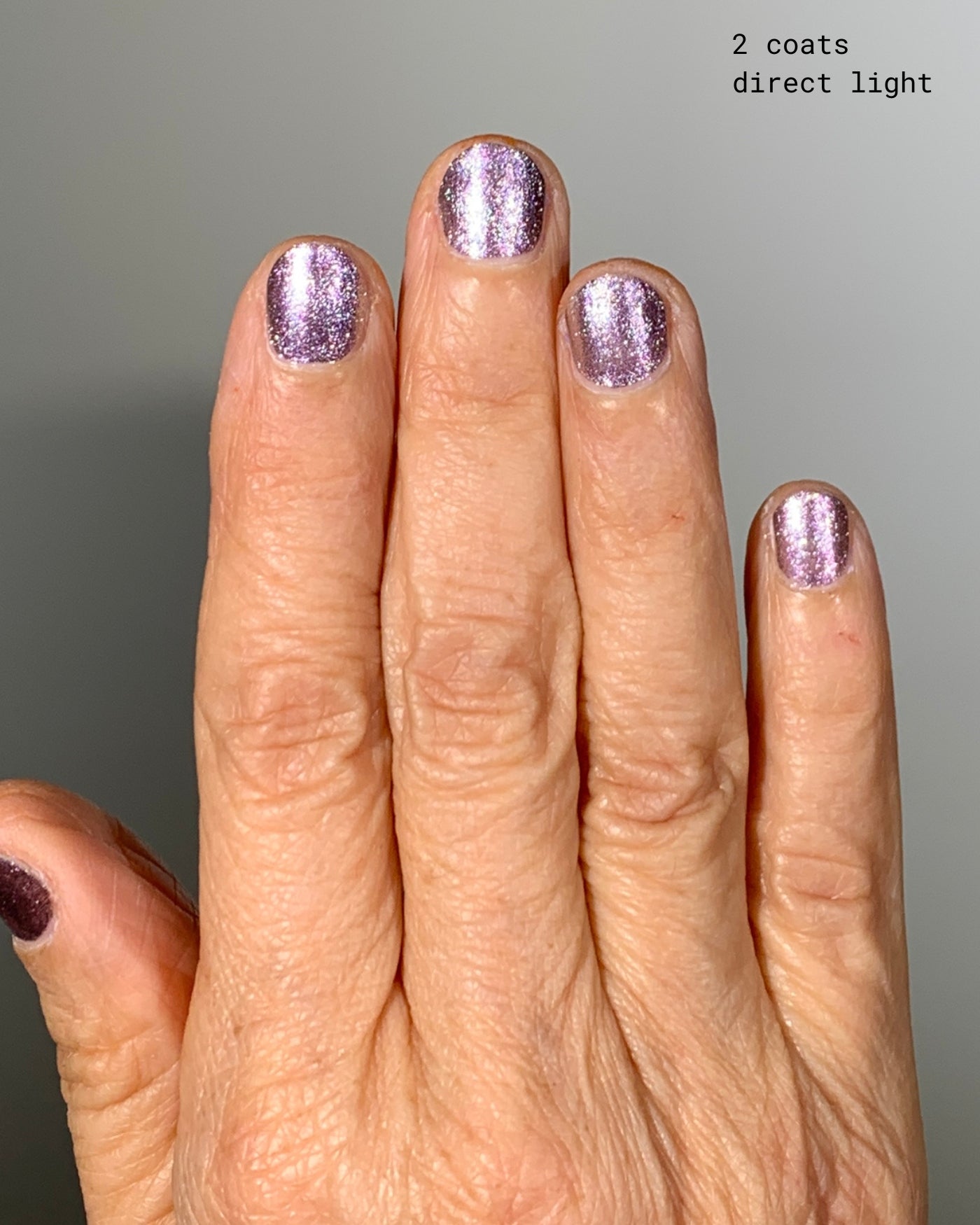 Shimmering lavender glitter Nightbreak nail polish in two coats