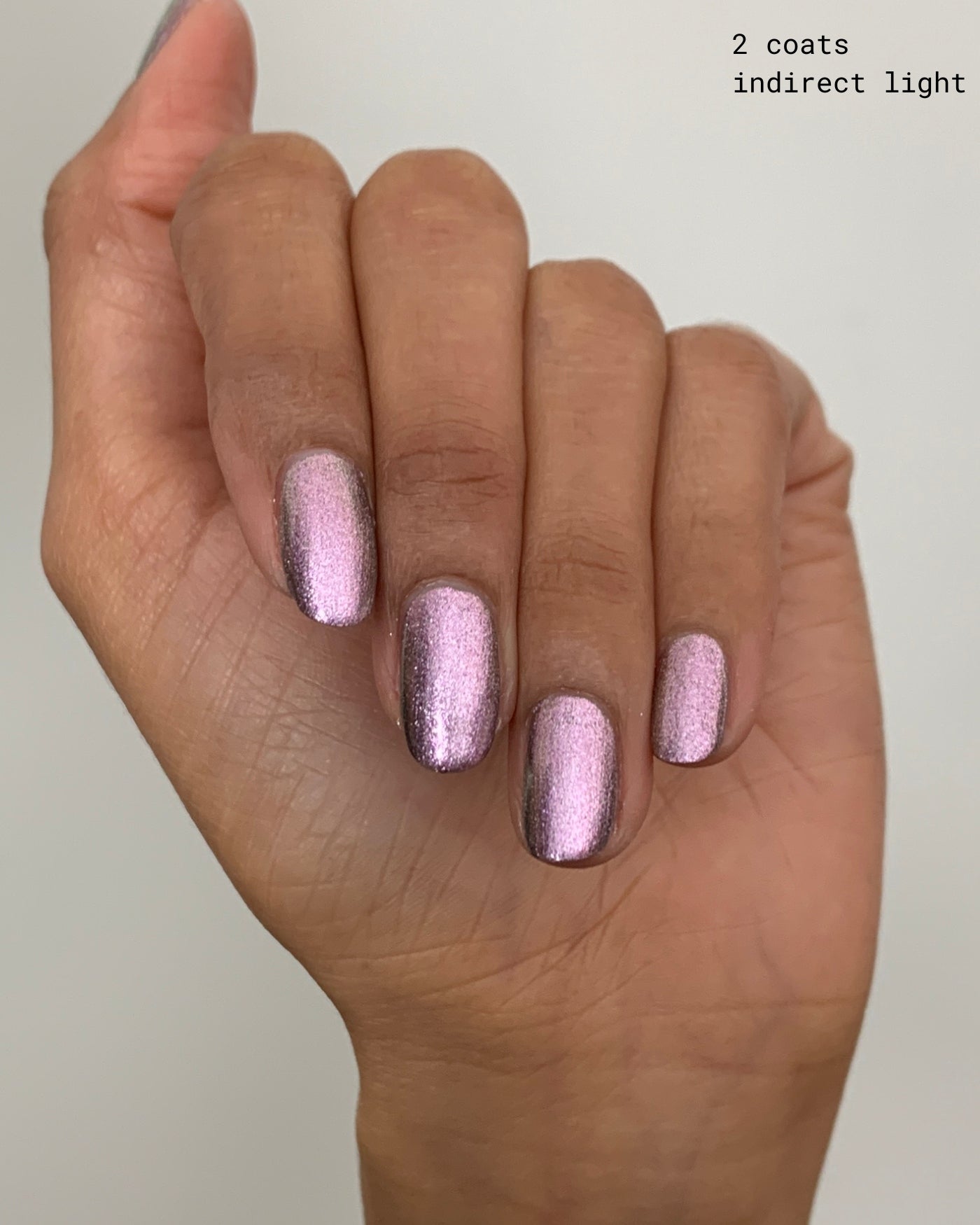 Shimmering rose gold Nightbreak nail polish with metallic finish, two coats