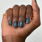 Dark blue glitter nail polish with iridescent shimmer in Sugar and Spice Topper