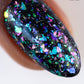 Glossy black nail polish with iridescent blue green purple pink glitter in Band Of Misfits II Set