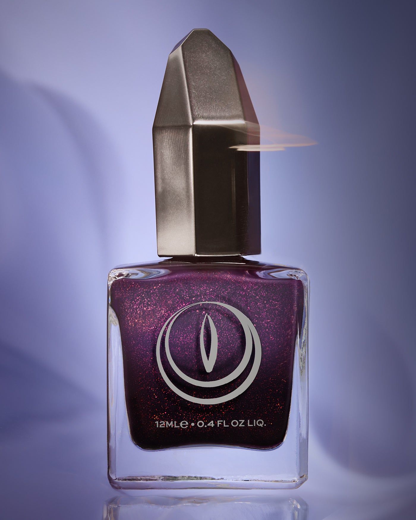 The Firebird shimmering purple nail polish in square glass bottle